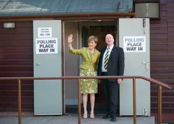 First Minister Nicola Sturgeon and her husband Peter Murrell cast their vote in Glasgow. Picture: John Devlin