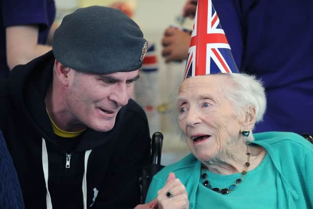 Wx-RAF man Darren Hogg joined in the celebrations with resident Moira Currie, aged 9.9 to mark VE Day.
Picture: Neil Hanna