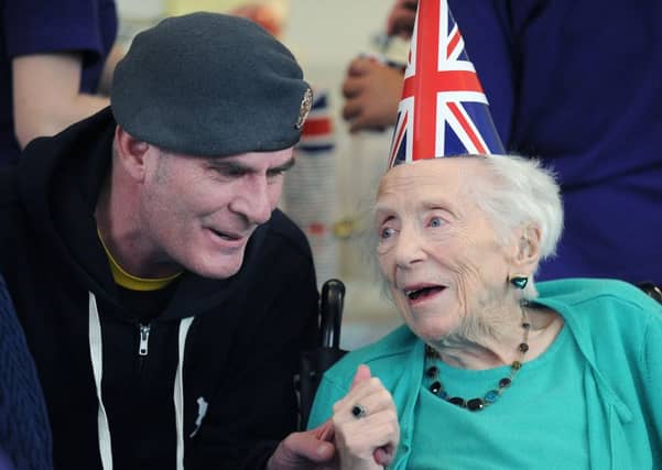 Wx-RAF man Darren Hogg joined in the celebrations with resident Moira Currie, aged 9.9 to mark VE Day.
Picture: Neil Hanna