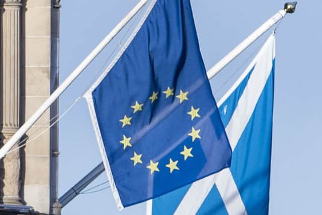 EU and Saltire flags hang over Edinburgh. Picture: Ian Georgeson