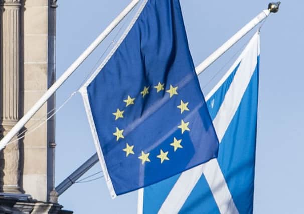 EU and Saltire flags hang over Edinburgh. Picture: Ian Georgeson