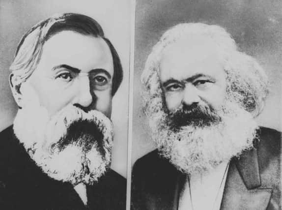 Karl Marx, right, and Frederick Engels, left, authors of The Communist Manifesto. Picture: AP