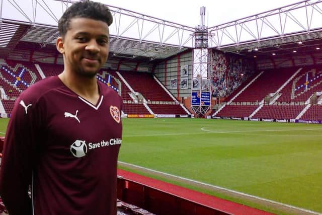 Osman Sow models the new home kit. Main picture: Twitter/@jamtarts
