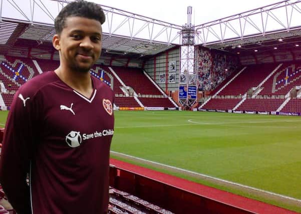 Osman Sow models the new home kit. Main picture: Twitter/@jamtarts