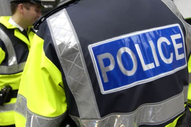 Police are hunting two men who robbed a patient on his way home from hospital.