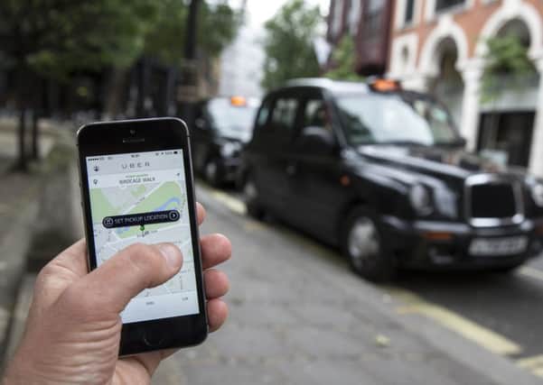 The Uber app in action in London. Picture: Oli Scarff/Getty Images