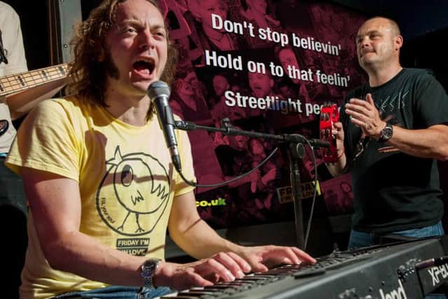 Al Murray plays the tambourine as the band play at last year's Fringe