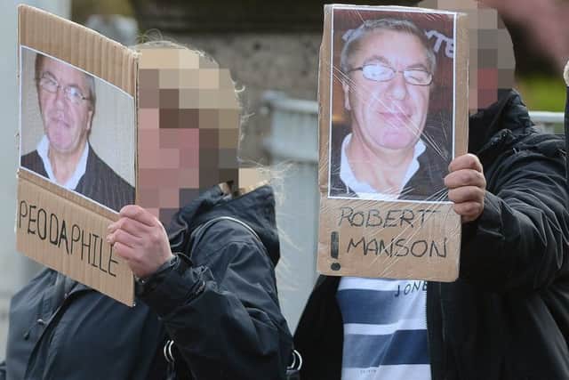 Victims' relatives armed with posters and banners were waiting at the gates of Saughton as Robert Manson was freed. Picture: Neil Hanna