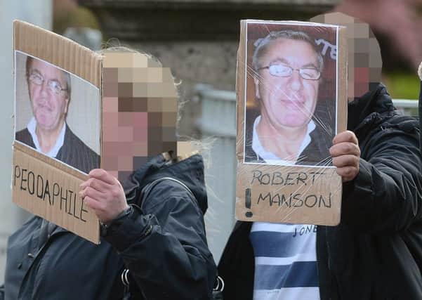 Victims' relatives armed with posters and banners were waiting at the gates of Saughton as Robert Manson was freed. Picture: Neil Hanna