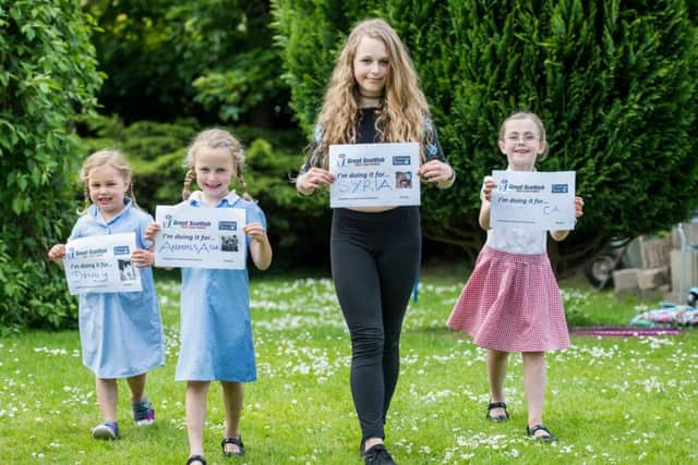 Tilly (4), Freya (6) and Ellis Imire (11) and Eva Watters (7) are ready to walk. Picture: Ian Georgeson
