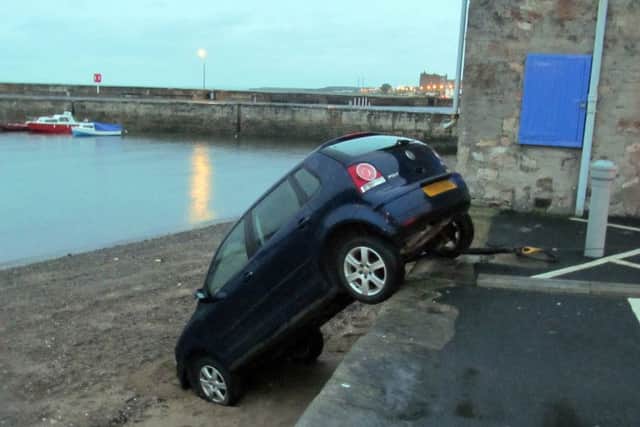The car rolled into the harbour.  Picture: Adrian McDowell