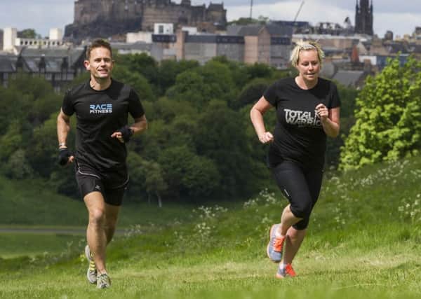 Kieron Ross puts Clare Smith through her paces on the slopes of Arthurs Seat as she prepares for three months of training ahead of the Total Warrior event in North Berwick. Picture: Scott Taylor