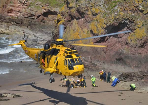 The girl is flown from the scene by helicopter. Picture: Jon Savage