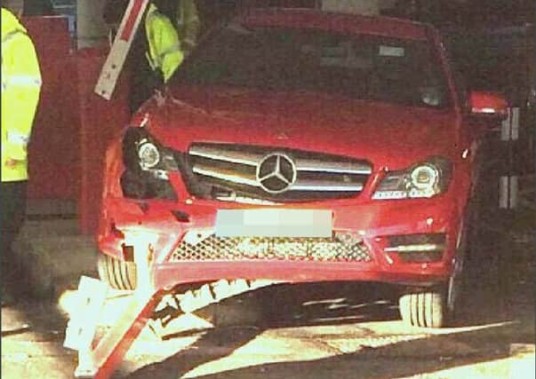 The barrier was wrecked when a motorist tried to pick up a dropped coin and accidentally put his vehicle in gear. Picture: Twitter