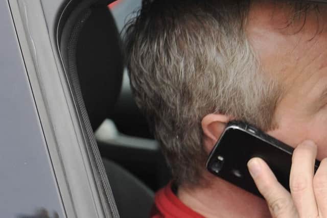 Using your mobile phone while driving is illegal.  Picture: Phil Wilkinson (Posed by model)