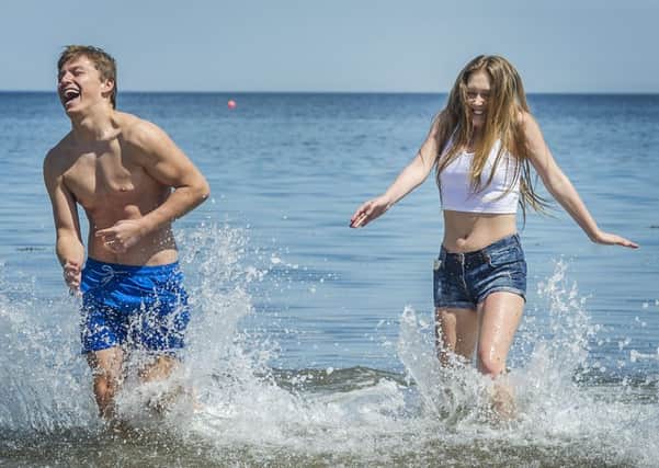 Ryan Steadwood and Natasha Hill cool off at Portobello beach. Picture: Scott Taylor