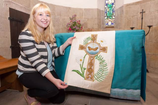 Lucy Deady puts her cloth on the altar