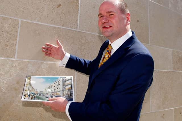 Martin Perry shows off the limestone option. Picture: Scott Louden