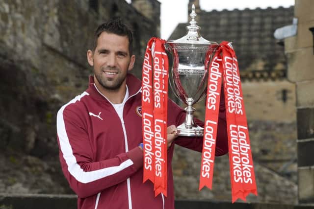 Neil Alexander shows off the Ladbrokes Championship trophy