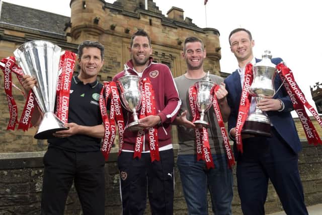 Celtic assistant John Collins, left, joined Hearts goalkeeper Neil Alexander (2nd from left), Morton captain Peter MacDonald (2nd from right) and Albion Rovers player-manager Darren Young as the Ladbrokes Premiership, Championship, League One and League Two fixtures were announced for the 2015/2016 are announced