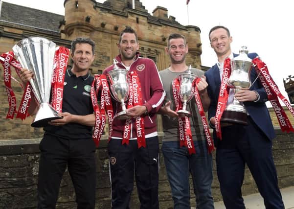 Celtic assistant John Collins, left, joined Hearts goalkeeper Neil Alexander (2nd from left), Morton captain Peter MacDonald (2nd from right) and Albion Rovers player-manager Darren Young as the Ladbrokes Premiership, Championship, League One and League Two fixtures were announced for the 2015/2016 are announced