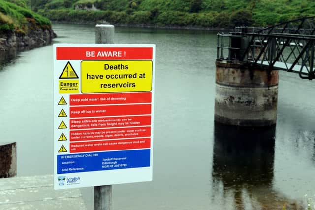 A warning sign at Torduff reservoir, where Bockarie Sonnah drowned last year. Picture: Lisa Ferguson