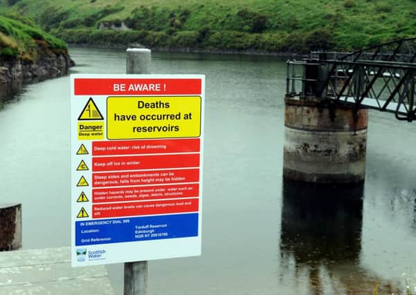 A warning sign at Torduff reservoir, where Bockarie Sonnah drowned last year. Picture: Lisa Ferguson