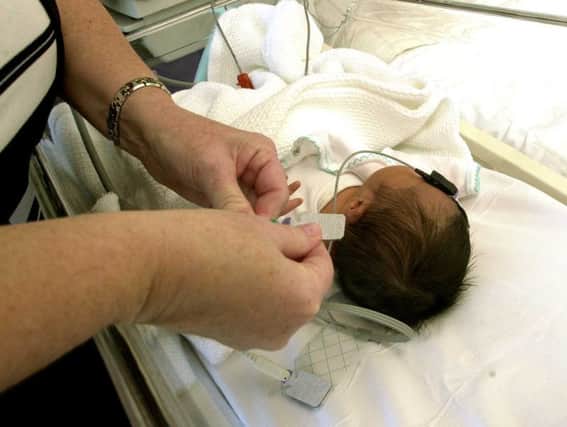 A baby receives treatment at St John's. Picture: Bill Henry