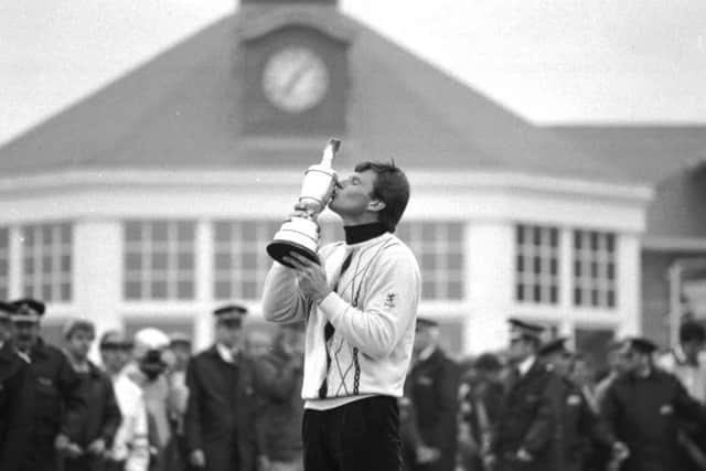 Nick Faldo, wearing a Pringle sweater, kisses the claret jug after winning the British Open at Muirfield in July 1987.