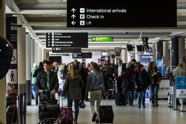 Edinburgh Airport. Holidaymakers have been told to pay outstanding fines before flying away on holiday or face jail. Picture: TSPL