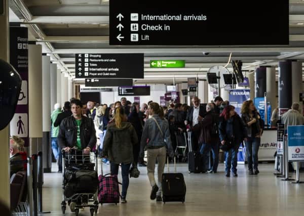 Edinburgh Airport. Holidaymakers have been told to pay outstanding fines before flying away on holiday or face jail. Picture: TSPL