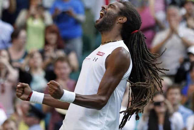 Dustin Brown celebrates after defeating Rafael Nadal. Picture: AP