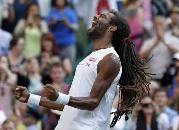 Dustin Brown celebrates after defeating Rafael Nadal. Picture: AP