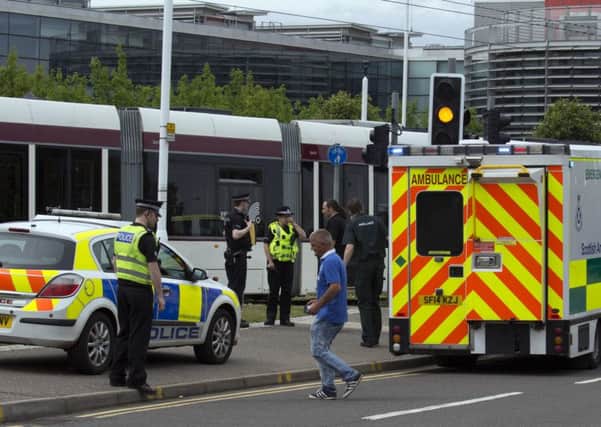 Police take statements after the man was hit by a tram near the Gyle at around 2pm yesterday. Picture: ALAN SIMPSON