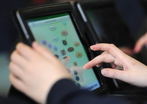 iPads have been issued to some city school pupils. Picture: Dan Phillips