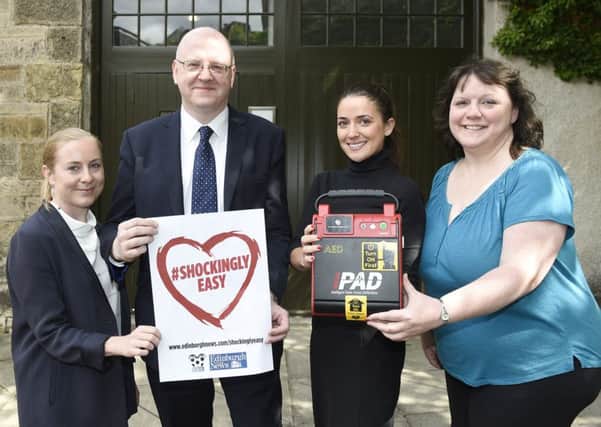 Katherine Newlands, David Ferguson, Lara Okan and Estelle Hollis from Crown Estate with their new defibrillator. Picture: Greg Macvean