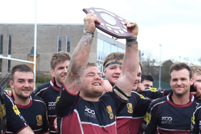 Darren Eales holds the Regional Bowl shield aloft in 2014. Picture: comp