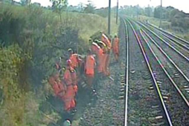 A group of nine track workers near Lancaster narrowly avoided being struck by a passenger train bound for Manchester Airport from Edinburgh. Picture: PA
