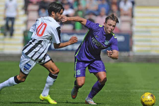 Fissile El Bahtaoui of Dunfermline tussles with Scott Allan of Hibs. Picture:  Neil Hanna