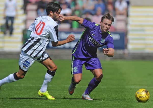Fissile El Bahtaoui of Dunfermline tussles with Scott Allan of Hibs. Picture:  Neil Hanna
