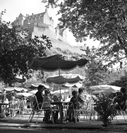 People enjoying the summer sunshine at The Piazza open-air cafe in Princes Street Gardens Edinburgh in August 1970