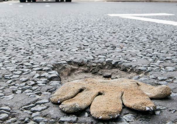 The offending garment has caused a pothole on the newly relaid St Johns Road. Picture: Ian Georgeson