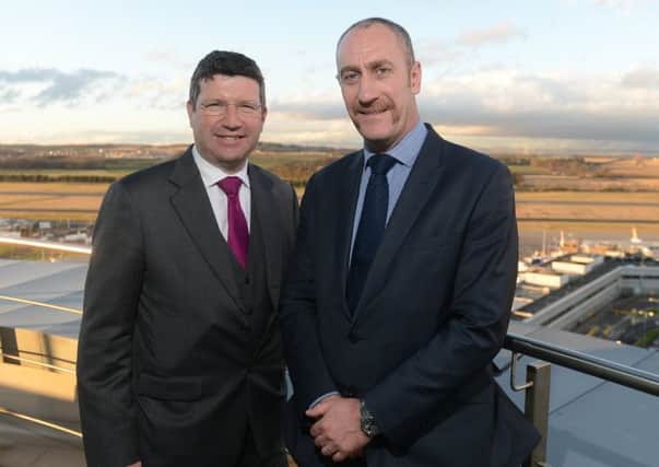 David Wilson, right, pictured with boss Gordon Dewar, oversaw months of chaos at the airport due to the new security hall. Pic: Neil Hanna