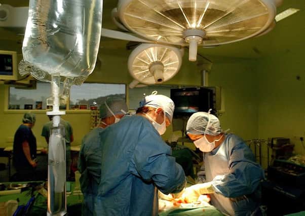 The flow of patients coming in and out of surgery is routine stuff for the professionals