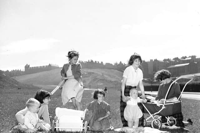 Girls playing mother in Holyrood Park, Edinburgh. Picture: TSPL