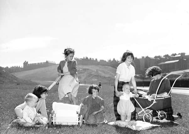 Girls playing mother in Holyrood Park, Edinburgh. Picture: TSPL