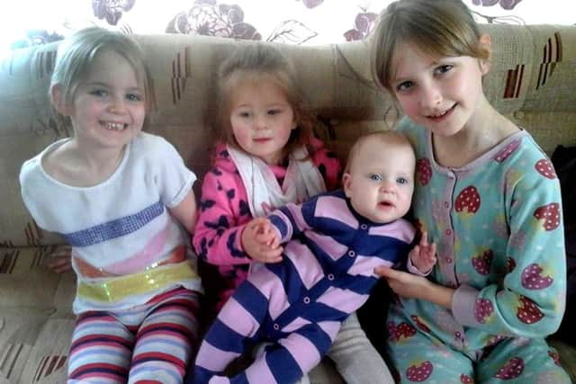 Little Emily Cressey with her sisters, from left, Millie, Brooke and Caitlin. Picture: Claire Cressey