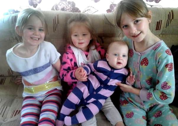 Little Emily Cressey with her sisters, from left, Millie, Brooke and Caitlin. Picture: Claire Cressey