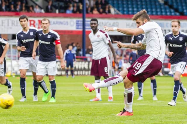 Juanma Delgado slots the ball home from the penalty spot to equalise for Hearts. Picture: SNS