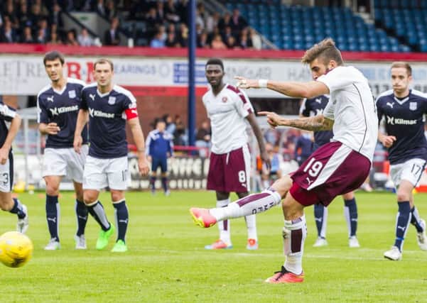Juanma Delgado slots the ball home from the penalty spot to equalise for Hearts. Picture: SNS